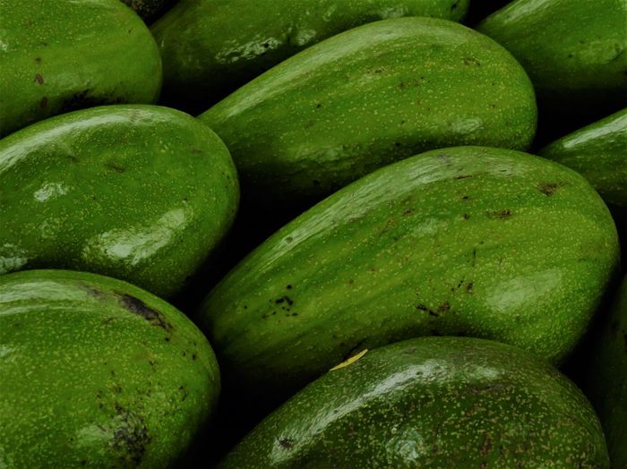 Full frame shot of avocados for sale in market