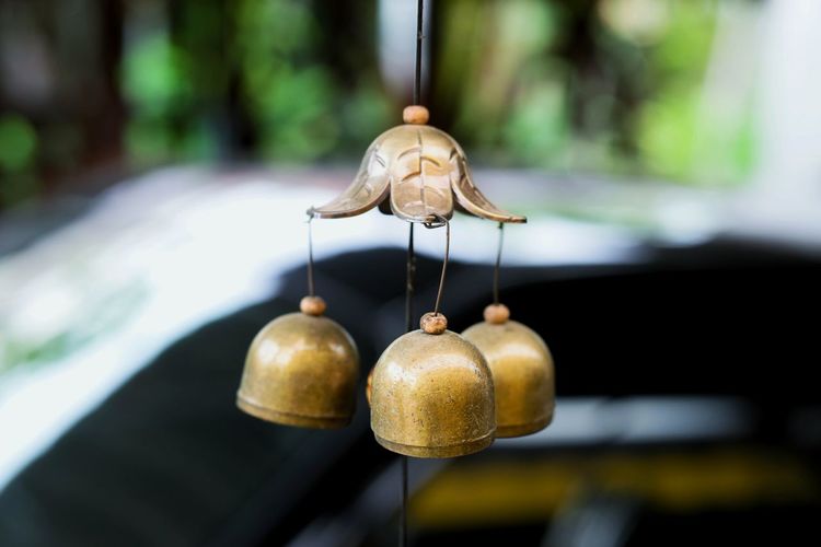 Close-up of golden wind chime