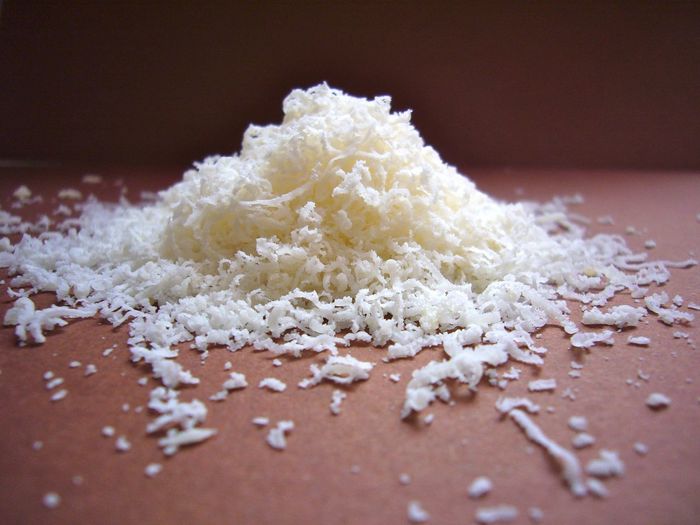 Grated cheese on table