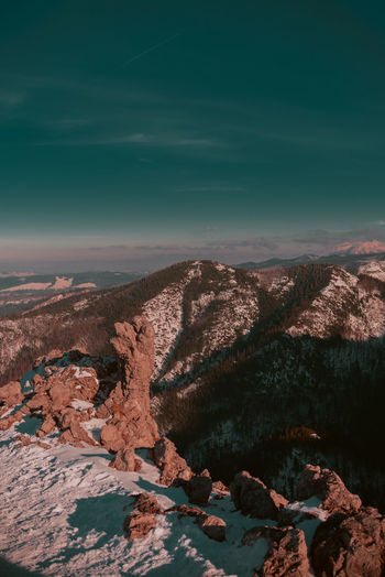 Aerial view of rocks on land against sky