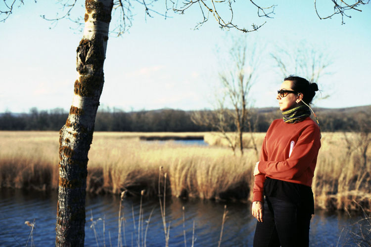 A woman posing on lakeside 