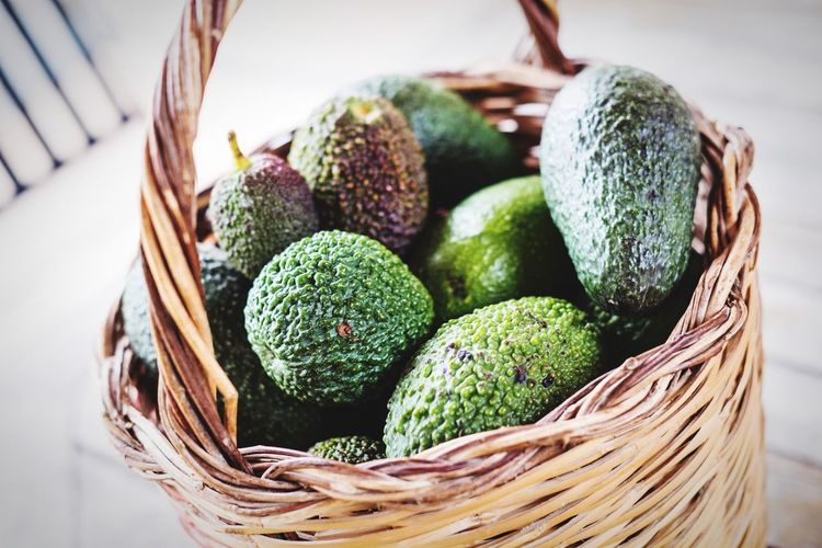 Close-up of avocadoes in basket