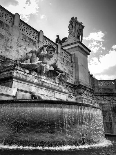 Low angle view of fountain against sky