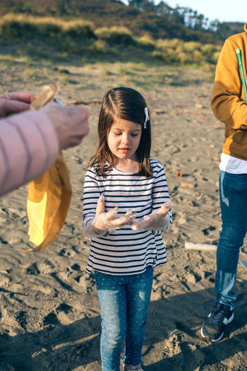 Siblings standing on land
