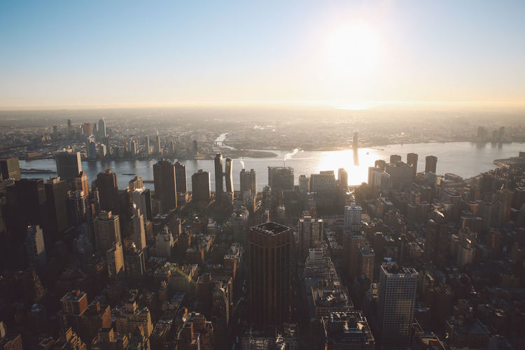 Aerial view of city at sunset