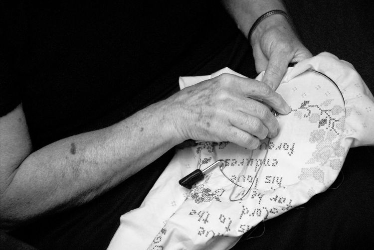 Close-up of hands doing needlework 