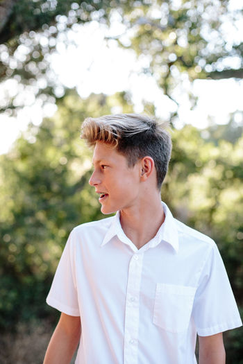 Portrait of the profile of teenager boy with braces