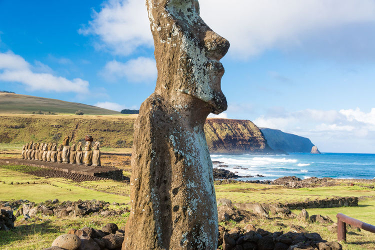 Moai statue at ahu tongariki against sky