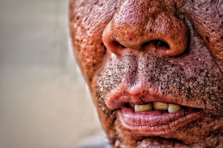 Cropped image of senior man with wrinkles on face