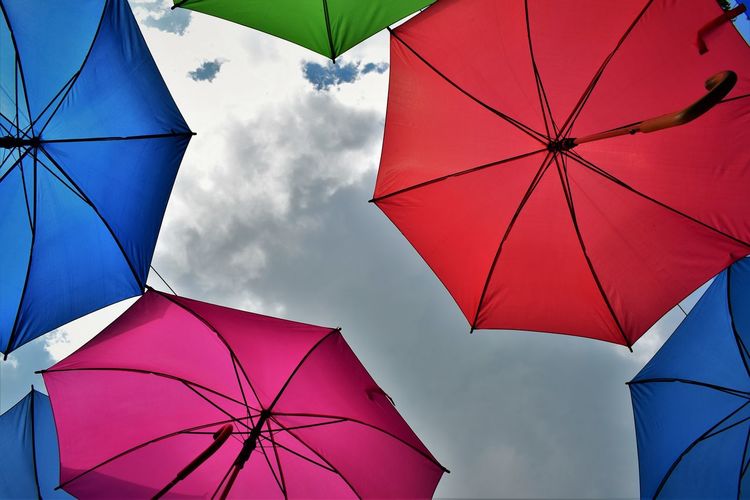 Low angle view of umbrella against sky
