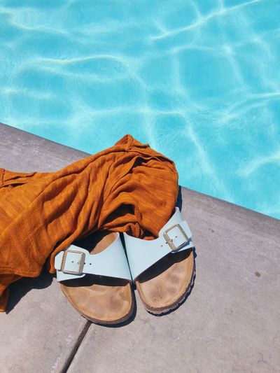 High angle view of sunglasses swimming pool