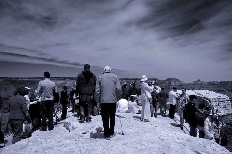 People at grand canyon national park against sky