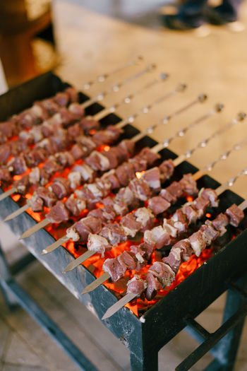 High angle view of meat on barbecue grill