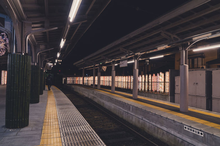 Train at railroad station at night