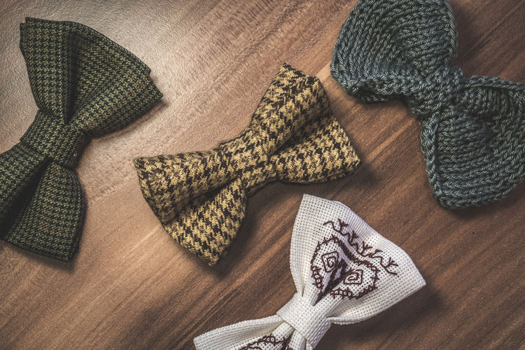 High angle view of bow tie on wooden table