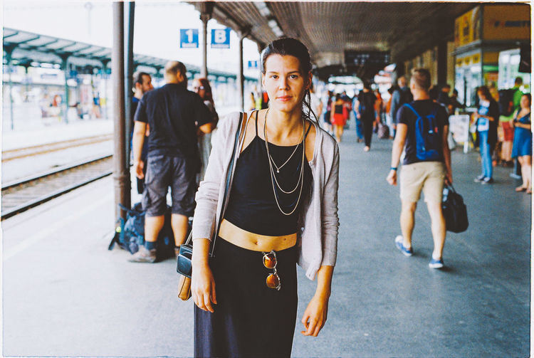Portrait of woman on railway station platform