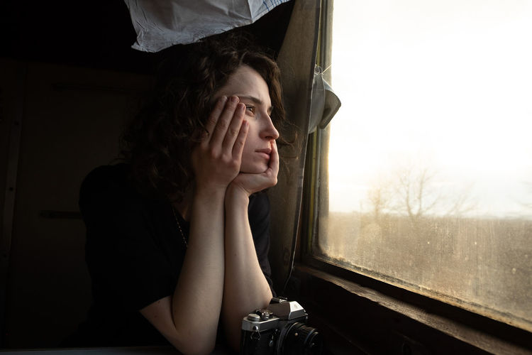 Portrait of young woman at train 
