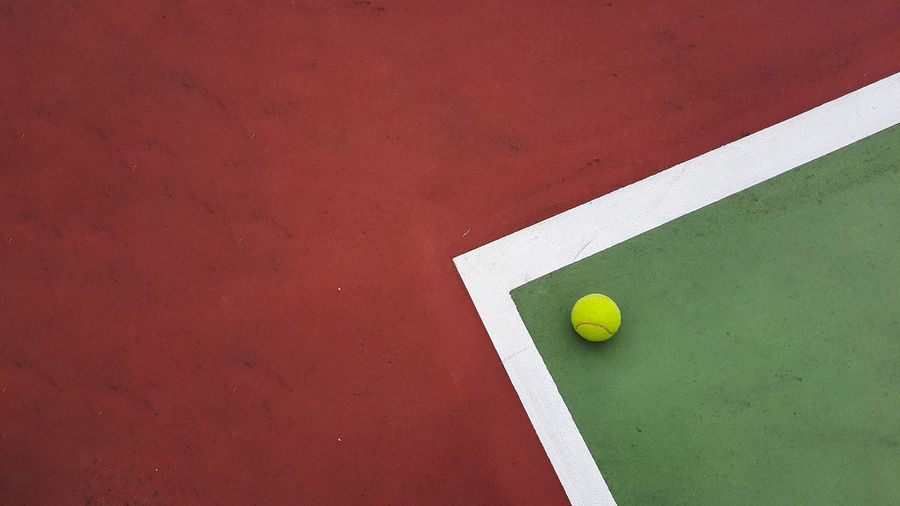 High angle view of tennis ball at the corner of tennis court