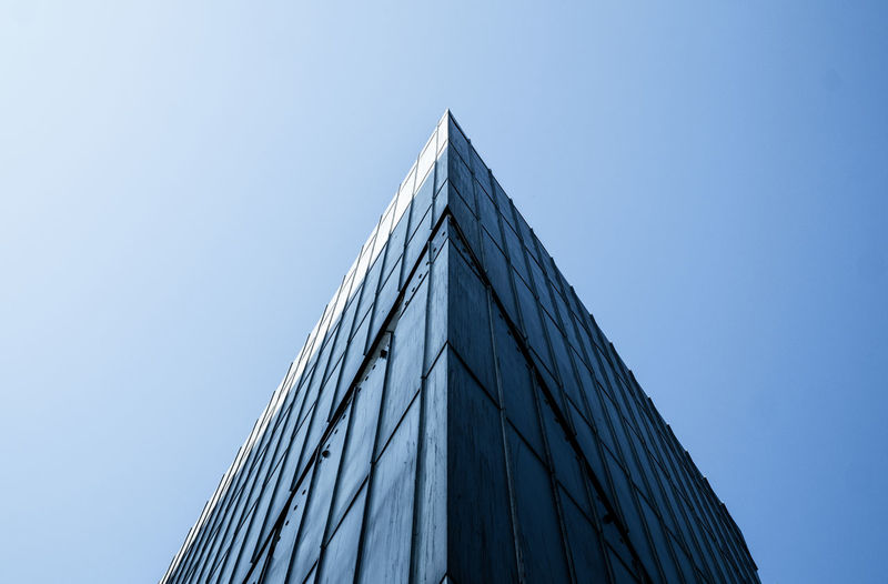 Low angle view of skyscraper against clear sky