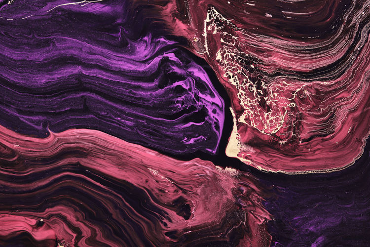 Fluid art. beautiful blue and purple waves with with liquid gold curls. marble effect background or