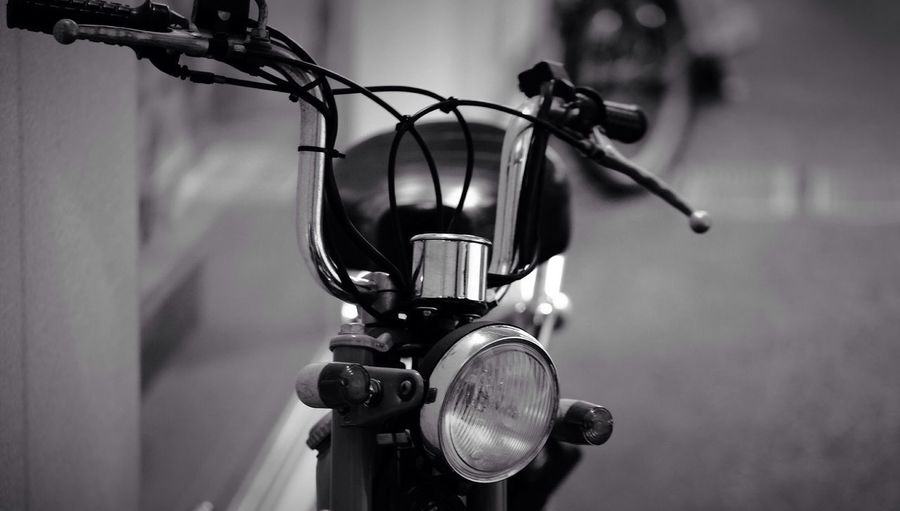 Close-up of handle of moped