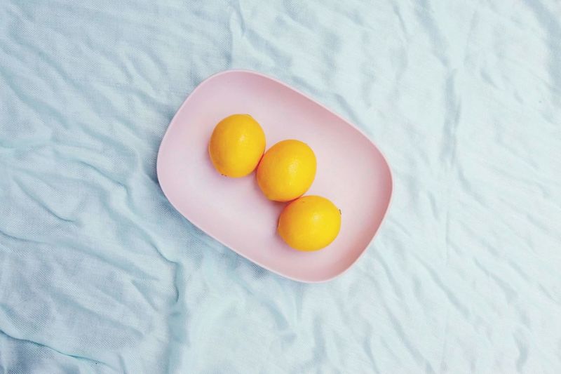 Directly above shot of lemons in plate on table