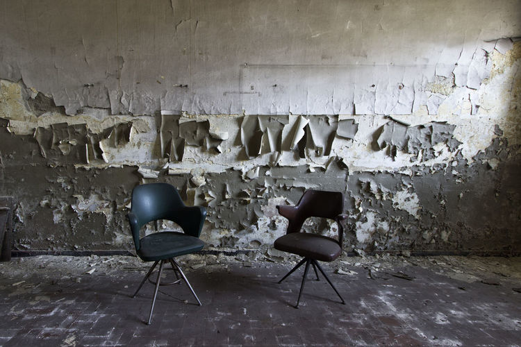 Empty chairs in abandoned room