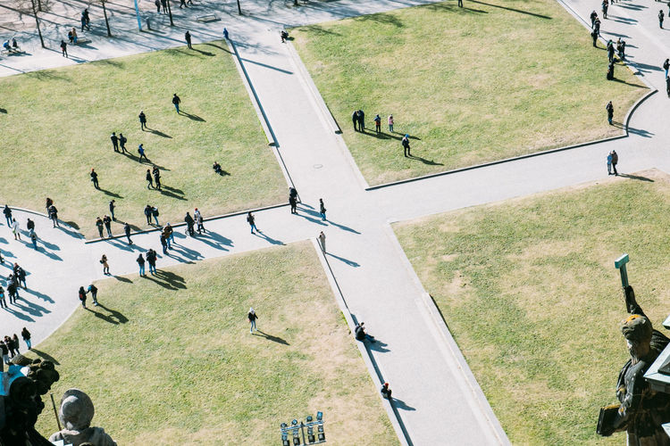 High angle view of people walking on field