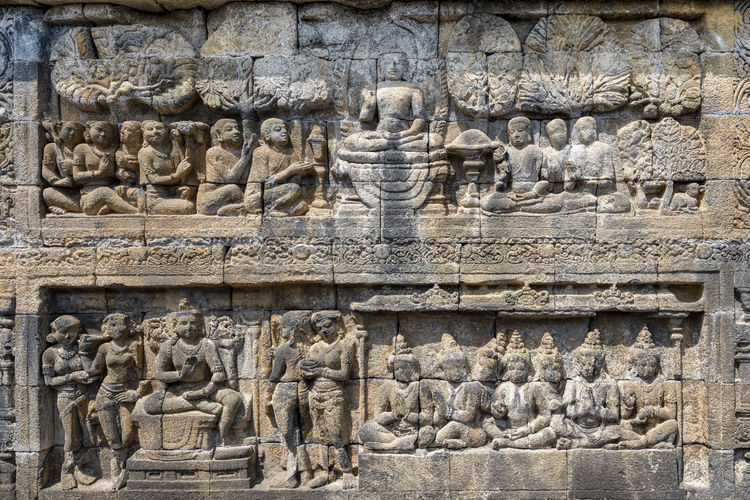Statue of carvings on wall