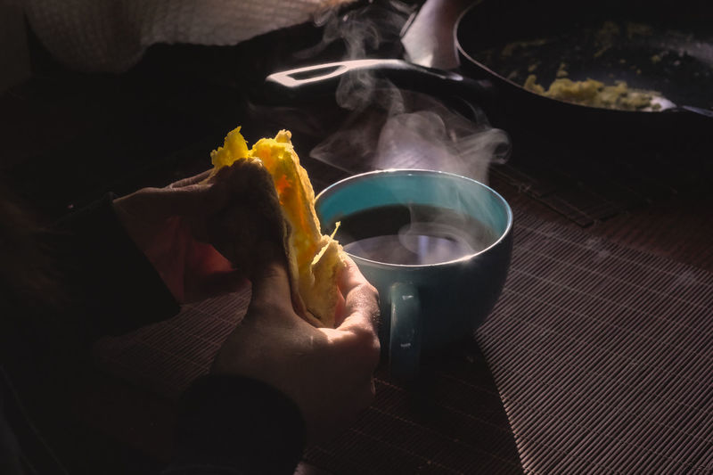 Breakfast in the morning, cold, hot tea, steam, scrambled eggs, dark photography food