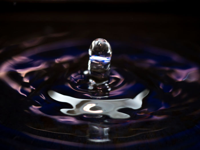 Close-up of water drop on glass