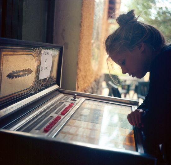 Close-up of girl looking at equipment