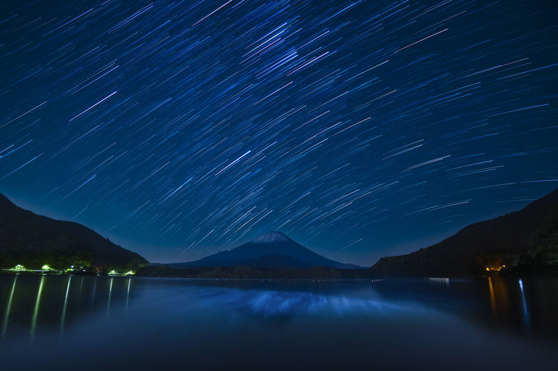 Star trails over mount fuji on a clear night from lake shoji, yamanashi prefecture, japan