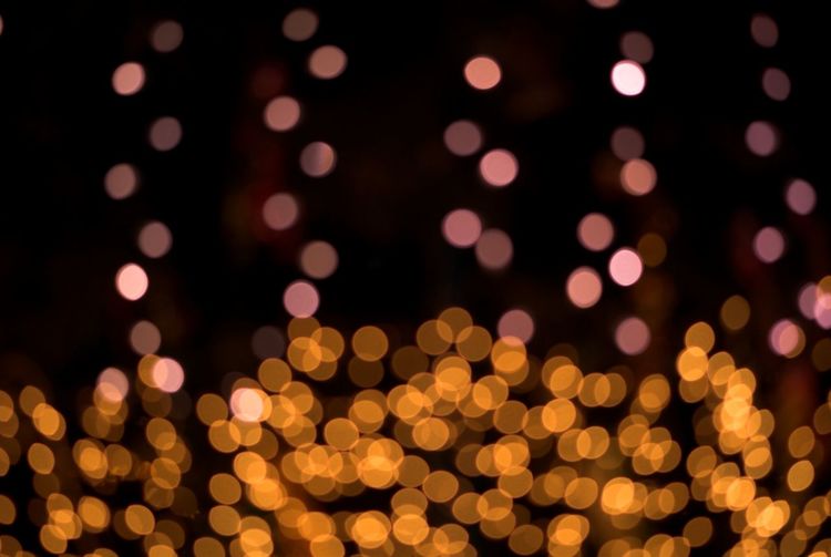 Defocused image of illuminated lights at night