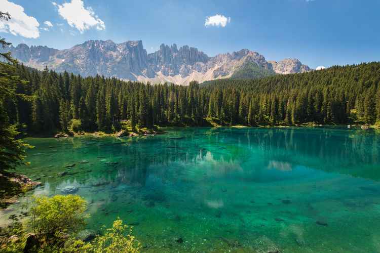 Panoramic view of carezza lake and mountains against sky
