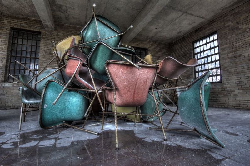 Interior of abandoned building with scrap furniture