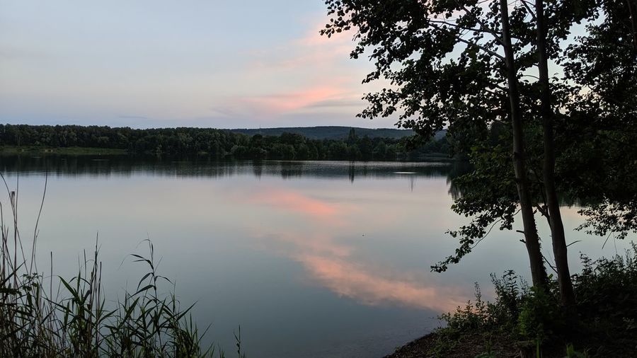 Scenic view of lake against sky during sunset