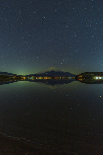 Mt. fuji and the starry sky in lake yamanaka