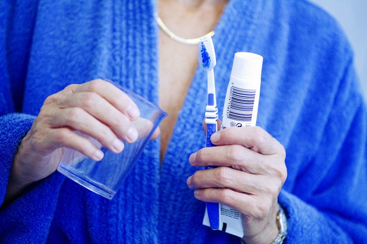 Close-up of a hand holding toothbrush