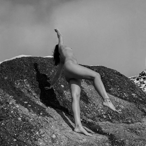 Side view of woman on rock