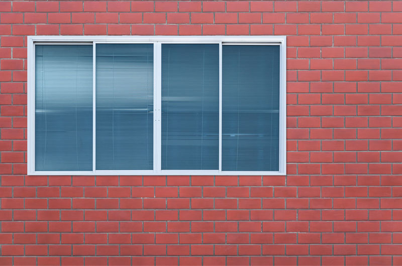 View of window on brick wall
