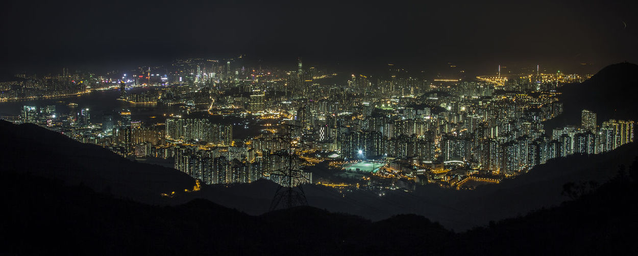 Panoramic view of illuminated city at night