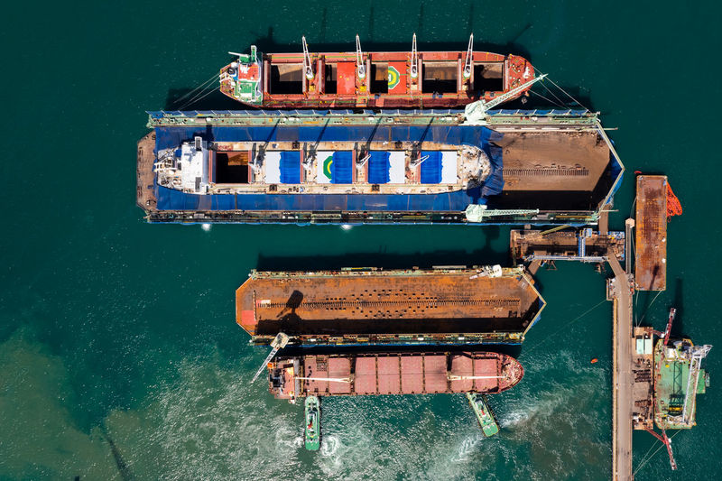 Aerial top view oil ship in shipyard for repair annd maintenance dry dock on the sea