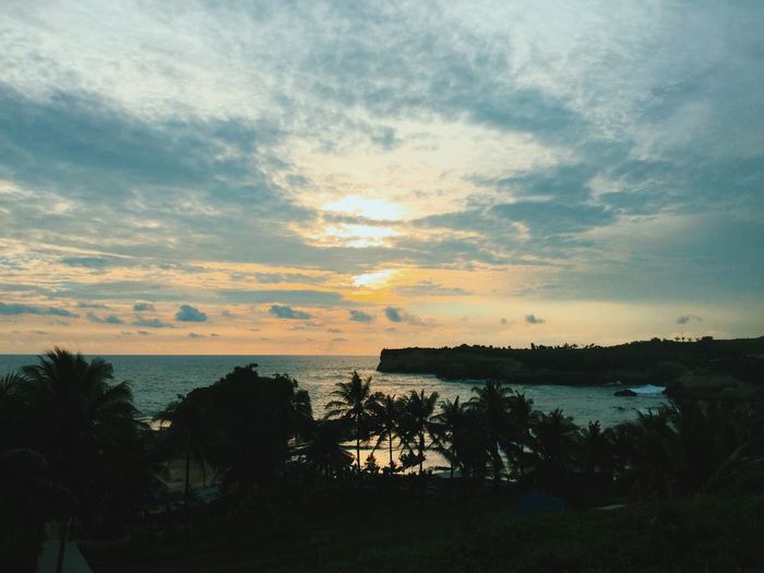 Scenic view of sea at sunset