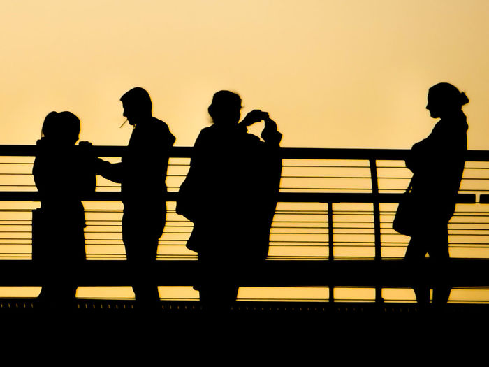Silhouette people at sunset