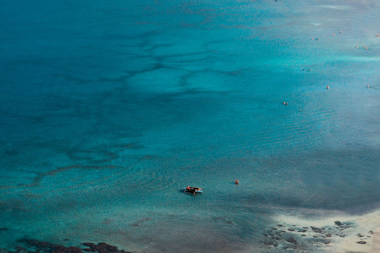 Scenic view of sea against blue sky