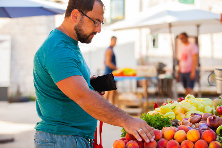 Full length of man standing in market