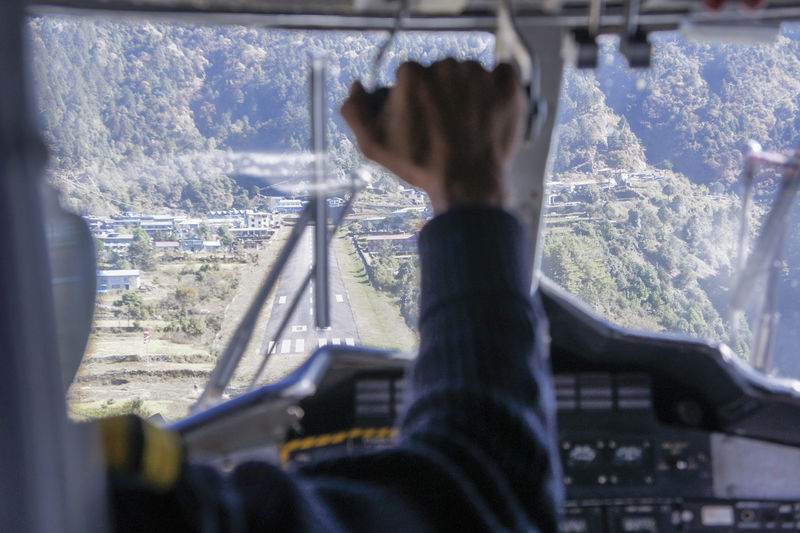 View of pilot flying airplane