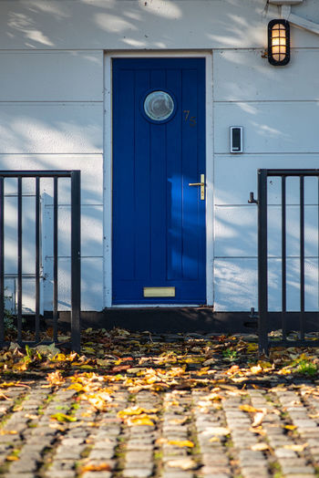The blue door with a porthole