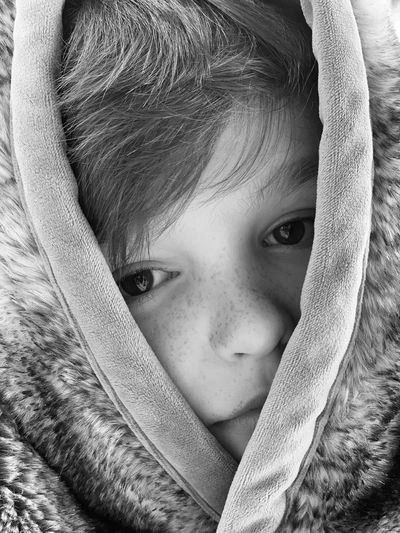 Close-up portrait of cute boy wearing warm clothing